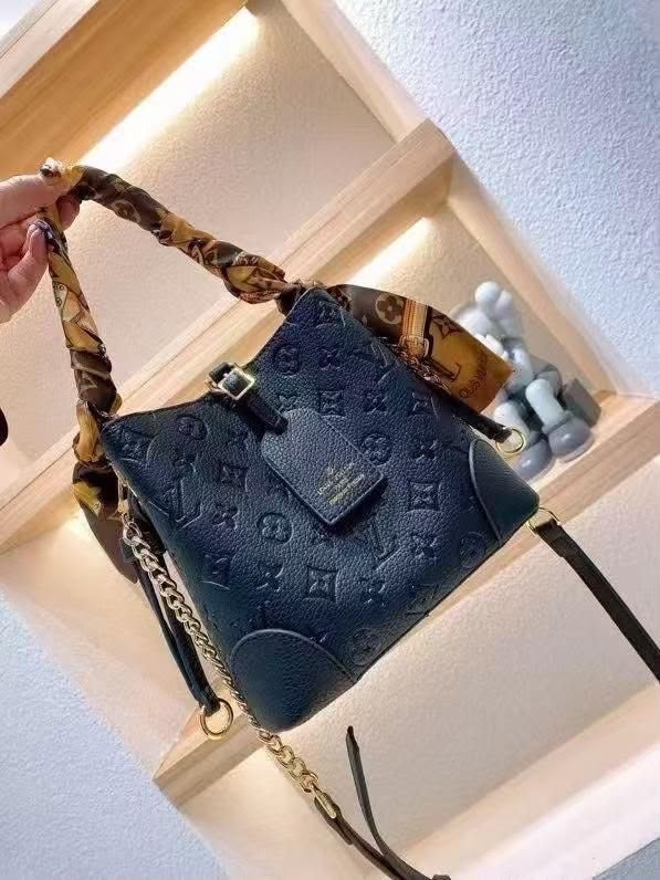 Louis Vuitton Black Embossed Monogram Bucket Bag – product view